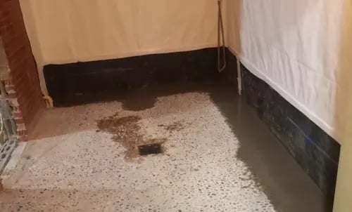 French Drain After Patched Concrete and Vapor Barrier on Walls- 500x300